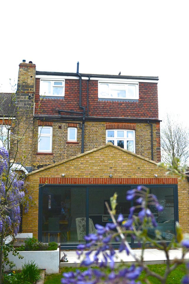 Full width patio doors open onto beautiful garden